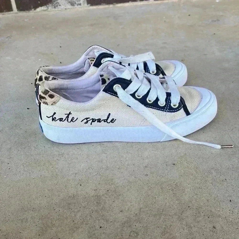 Keds beige canvas sneakers with black trim and leopard heel